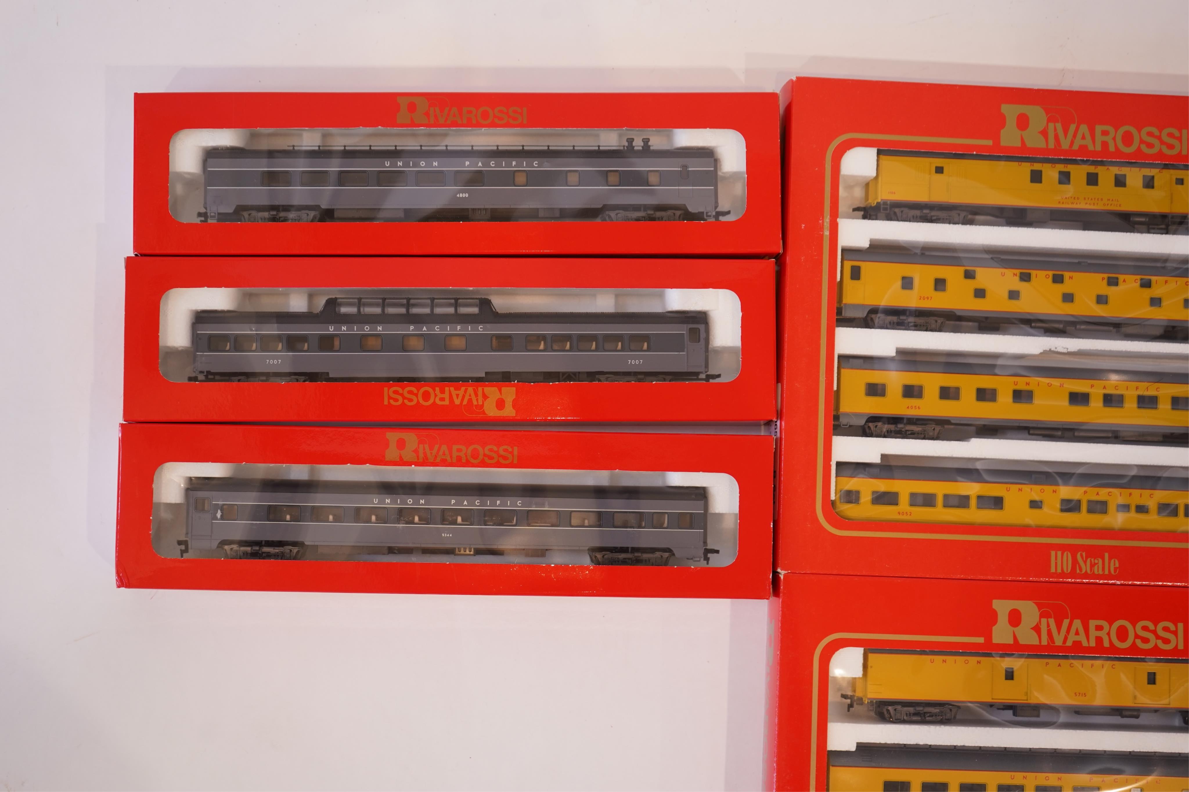 Two boxed Rivarossi 1930s Union Pacific coach packs; A Set (6964) and B Set (6965), both containing four coaches, together with three individually boxed coaches (2654, 2689 and 2814), plus four bogie freight wagons (2255